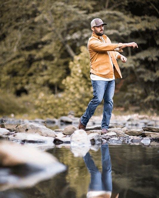 Banded Casual Canvas Camp Shirt Jacket in color Duck model Josh Dokken young man skipping rocks in creek bed