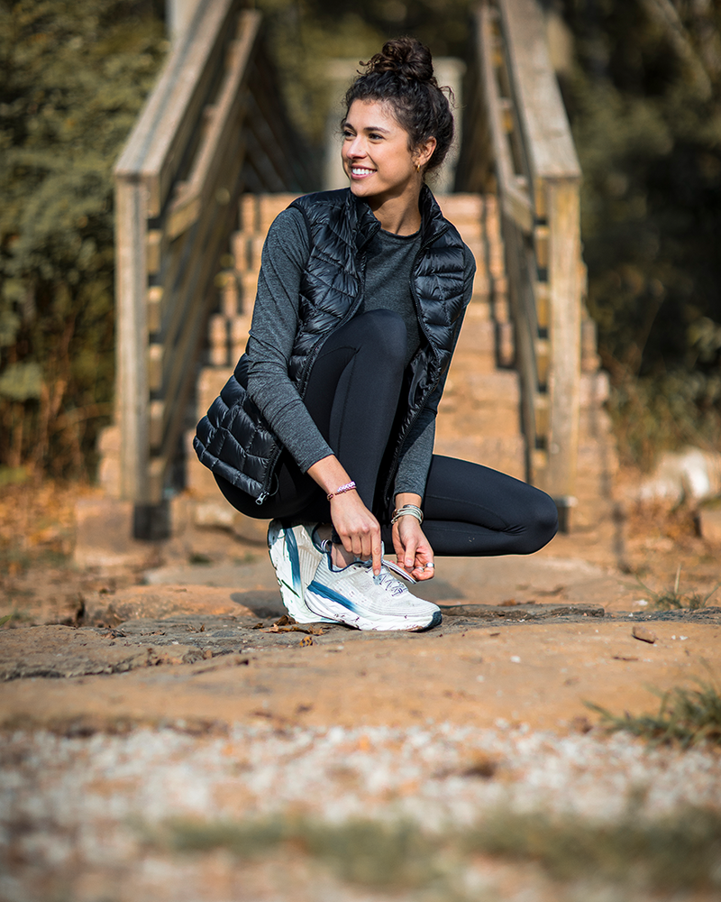 Banded Casual Women's Renew Down Vest model Tori Lee enjoying a morning run outdoors